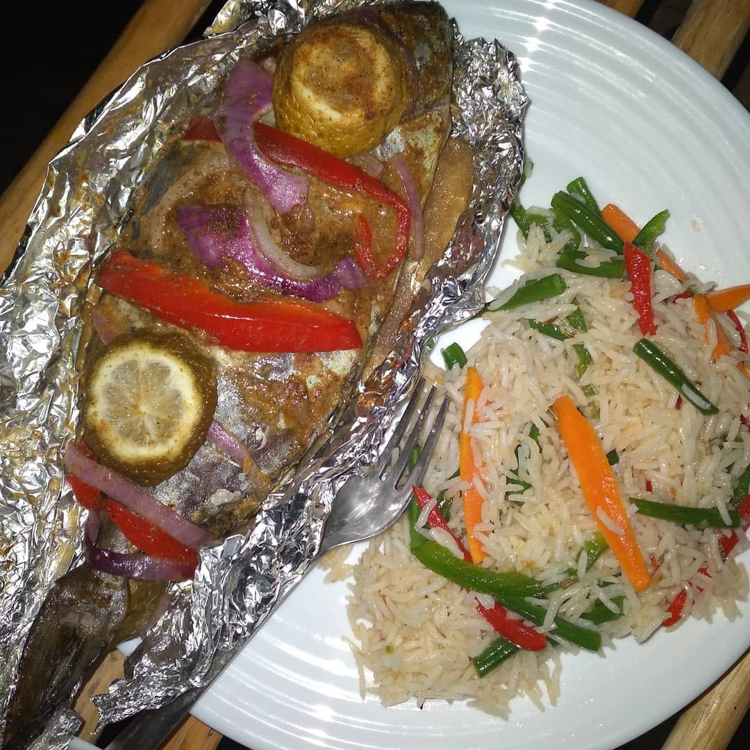 Foil-baked fish & rice served at Chill Spot Diani