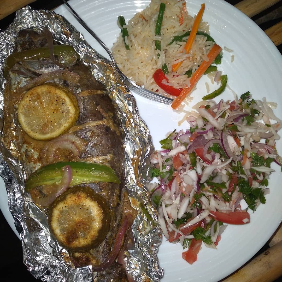 Fish, rice & kachumbari served at Chill Spot Diani