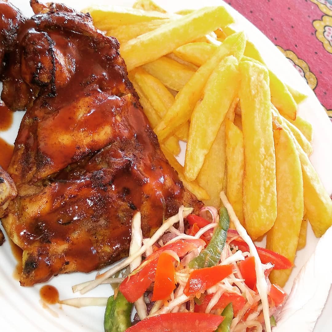 Grilled chicken & chips served at Chill Spot Diani